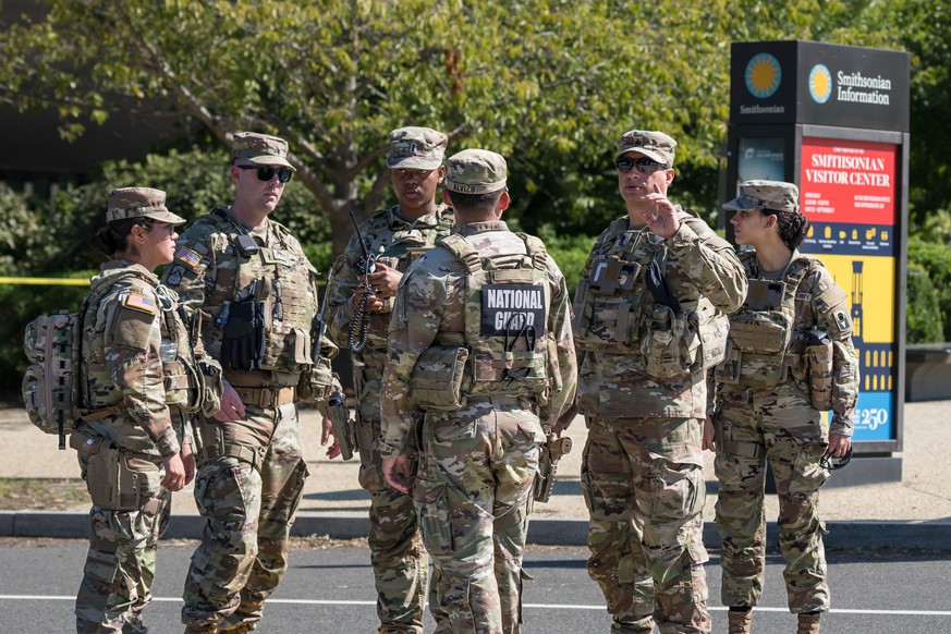 National Guard troops control a street near a closed intersection where President Donald Trump was holding an event, in Washington, Tuesday, Sept. 8, 2026. (AP Photo/J. Scott Applewhite)
Washington Da ...