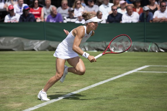 Viktorija Golubic of Switzerland in action during her first round match against Iga Swiatek of Poland, at the All England Lawn Tennis Championships in Wimbledon, London, on Monday, July 1, 2019.(KEYST ...