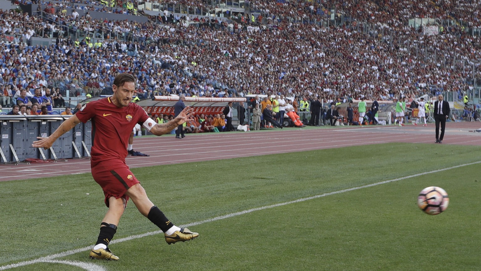 Roma&#039;s Francesco Totti shoots the ball during an Italian Serie A soccer match between Roma and Genoa at the Olympic stadium in Rome, Sunday, May 28, 2017. Francesco Totti is playing his final mat ...