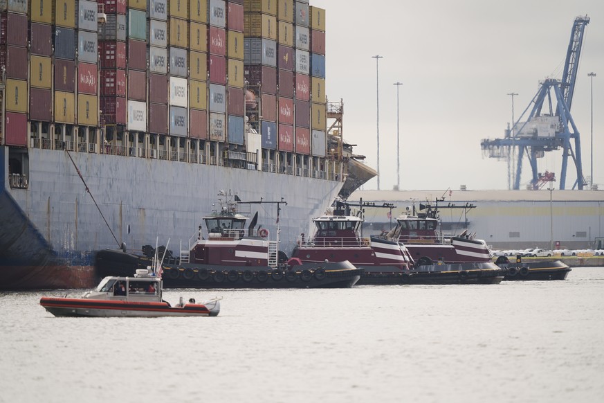 Tugboats escort the container ship Dali after it was refloated in Baltimore, Monday, May 20, 2024. The recovery from the deadly Baltimore bridge collapse reached a significant milestone Monday as the  ...