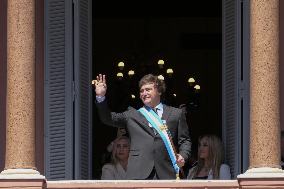 epa11022279 The president of Argentina, Javier Milei, gestures at the end of his speech on the balcony of the Casa Rosada in Buenos Aires, Argentina, 10 December 2023. Milei arrived at the Casa Rosada ...