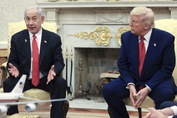 President Donald Trump, right, listens as Israel&#039;s Prime Minister Benjamin Netanyahu speaks during a meeting in the Oval Office at the White House in Washington, Monday, April 7, 2025. (Pool via  ...