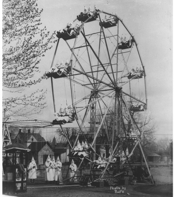 This April 1926 photo by Clinton Rolfe shows members of the Ku Klux Klan posing on a ferris wheel at the fairgrounds in Caon City, Colorado. (Photo courtesy of the Royal Gorge Regional Museum &amp; H ...