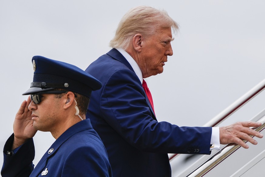 President Donald Trump climbs the stairs to Air Force One, Sunday, Sept. 21, 2025, at Joint Base Andrews, Md. (AP Photo/Julia Demaree Nikhinson)
Trump