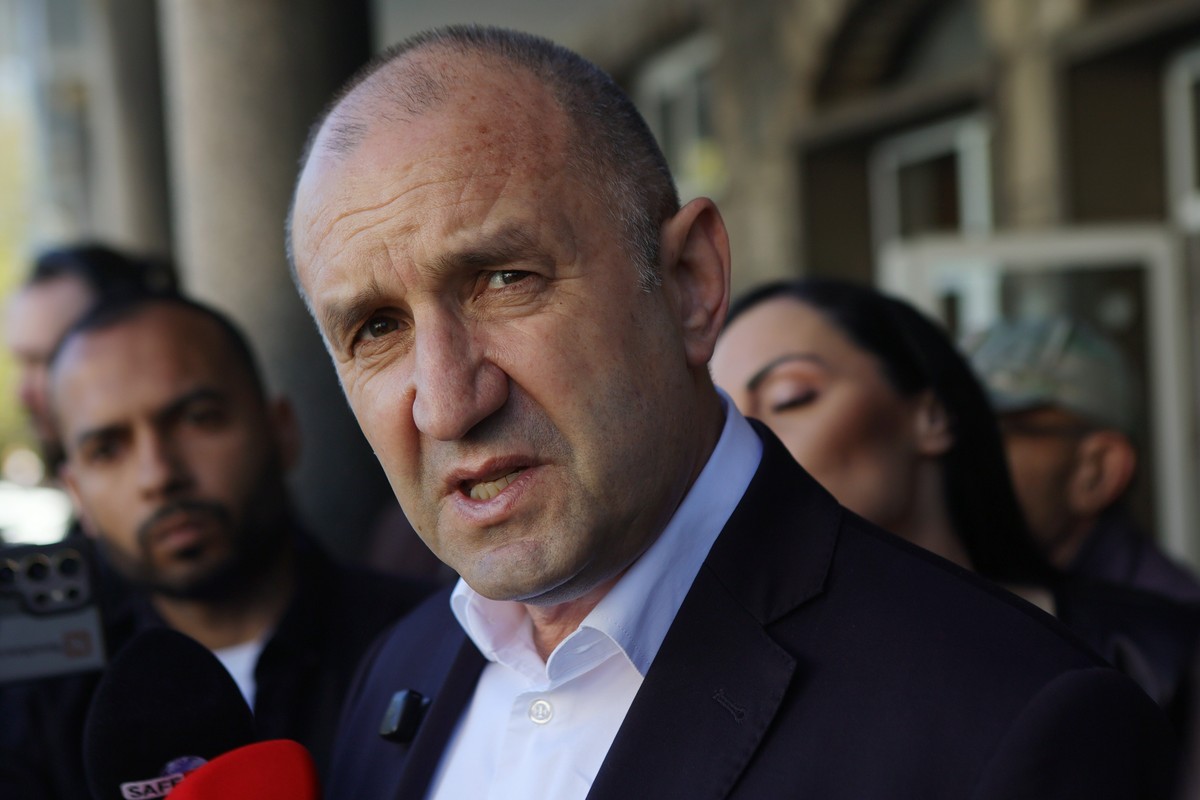 Former Bulgarian President Rumen Radev speaks to journalists after casting his vote at a polling station in Sofia, Bulgaria, Sunday, April 19, 2026, during early parliamentary elections. (AP Photo/Val ...