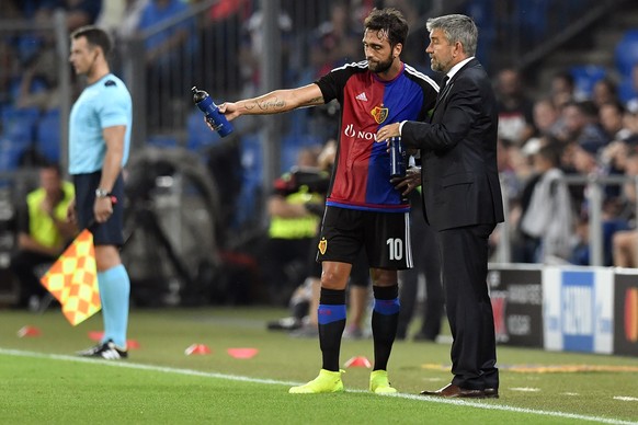 Basel&#039;s head coach Urs Fischer, right, speak with Matias Delgado during an UEFA Champions League Group stage Group A matchday 1 soccer match between Switzerland&#039;s FC Basel 1893 and Bulgaria& ...