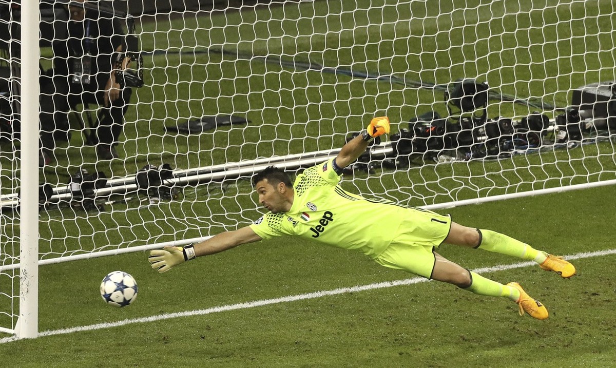 Juventus goalkeeper Gianluigi Buffon is beaten by Real Madrid's Casemiro scoring his side's 2nd goal during the Champions League Final soccer match between Juventus and Real Madrid at the Mi ...