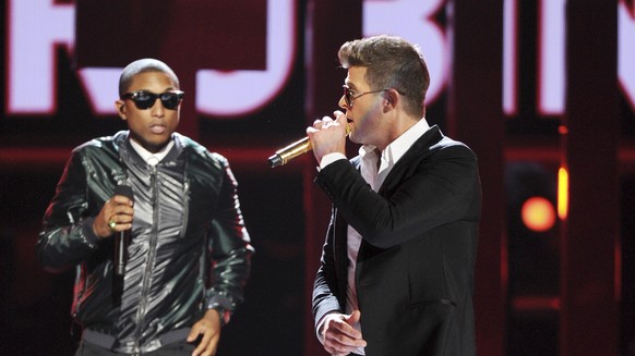 FILE - In this June 30, 2013 file photo, Pharrell Williams, left, and Robin Thicke perform onstage at the BET Awards at the Nokia Theatre in Los Angeles. More and more, contemporary artists are giving ...