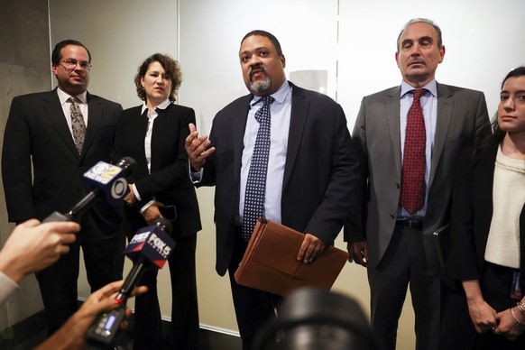Manhattan District Attorney Alvin Bragg, center, surrounded by his legal team, speaks to the media after the jury found the Trump Organization guilty on all counts in a criminal tax fraud case, Tuesda ...