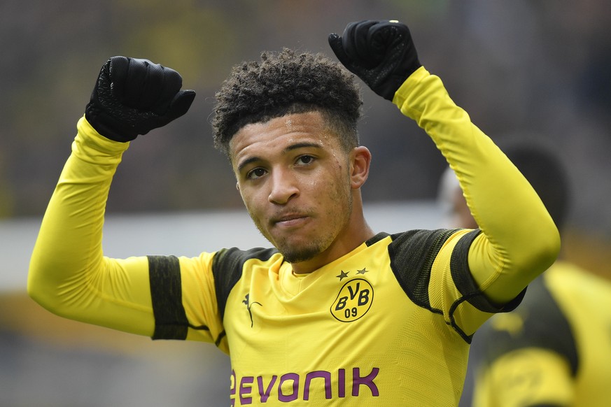 Dortmund&#039;s Jadon Sancho celebrates after scoring during the German Bundesliga soccer match between Borussia Dortmund and FSV Mainz 05 in Dortmund, Germany, Saturday, April 13, 2019. (AP Photo/Mar ...