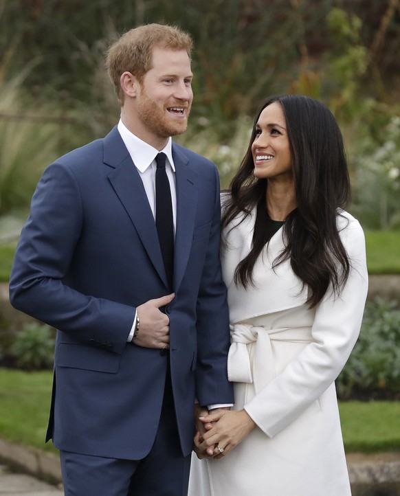 Britain&#039;s Prince Harry and his fiancee Meghan Markle pose for photographers during a photocall in the grounds of Kensington Palace in London, Monday Nov. 27, 2017. Britain&#039;s royal palace say ...