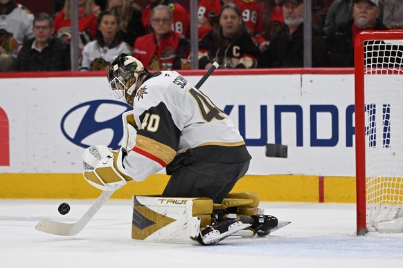 Vegas Golden Knights goalie Akira Schmid makes a save during the second period of an NHL hockey game against the Chicago Blackhawks, Sunday, Jan. 4, 2026, in Chicago. (AP Photo/Paul Beaty)
Golden Knig ...