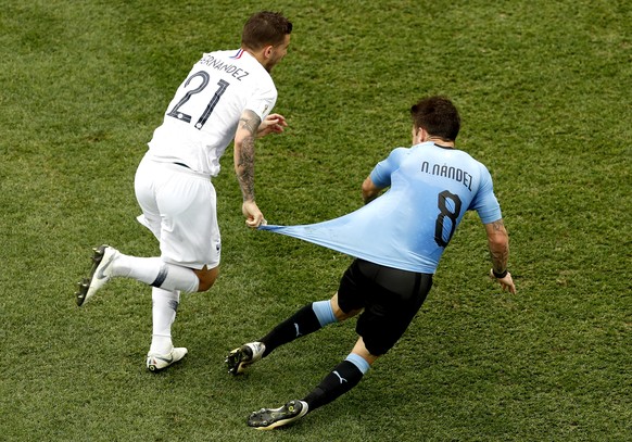 epa06868417 Lucas Hernandez of France (L) and Nahitan Nandez of Uruguay in action during the FIFA World Cup 2018 quarter final soccer match between Uruguay and France in Nizhny Novgorod, Russia, 06 Ju ...