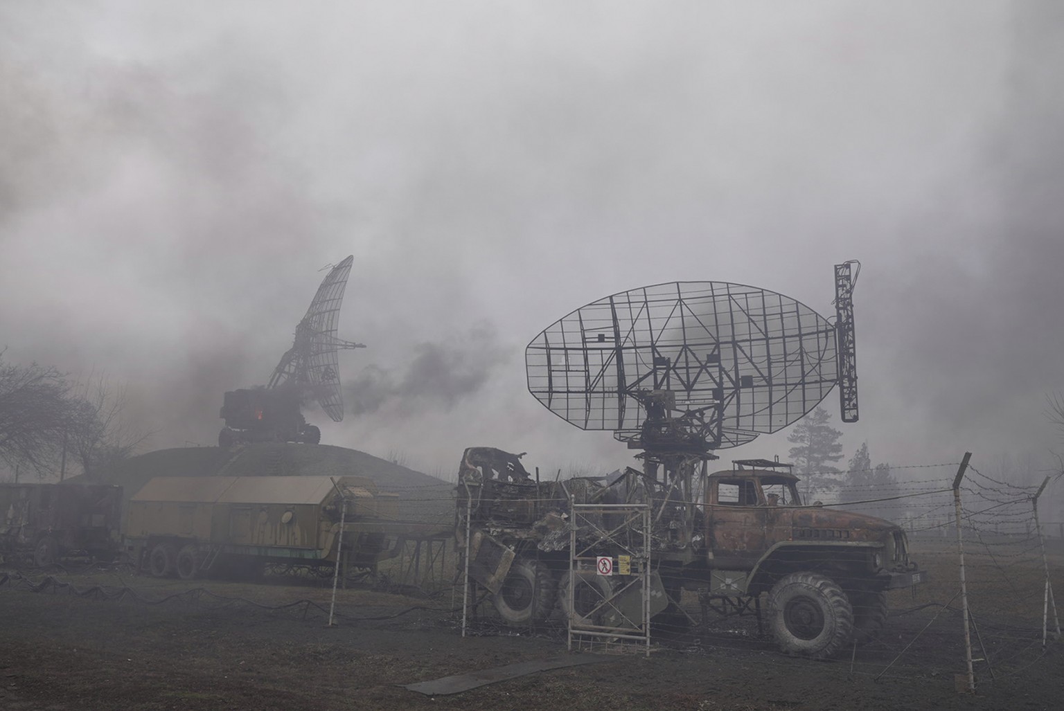 Smoke rise from an air defense base in the aftermath of an apparent Russian strike in Mariupol, Ukraine, Thursday, Feb. 24, 2022. Russian troops have launched their anticipated attack on Ukraine. Big ...