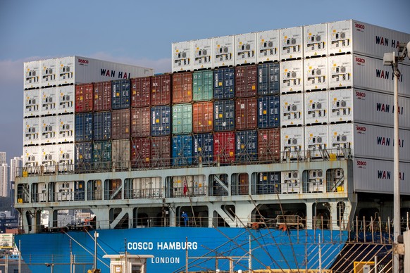 epa09557221 A container ship in berthed in the Kwai Tsing Container Terminals in Hong Kong, China, 01 November 2021. There are currently nine container terminals in Hong Kong, one of several hub ports ...