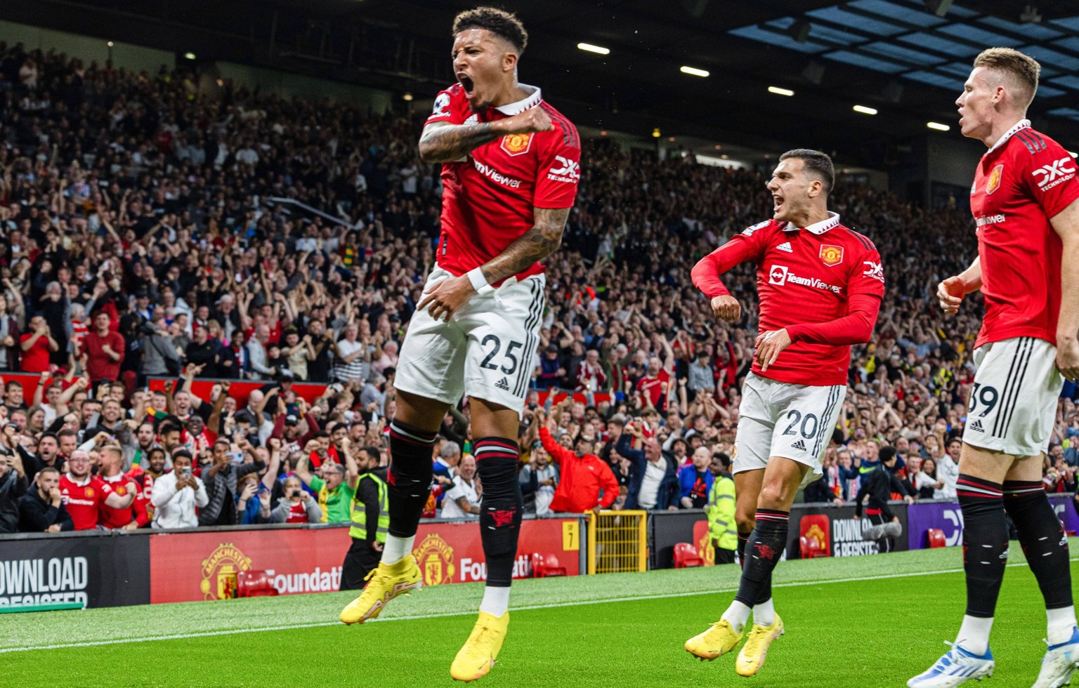220823 -- MANCHESTER, Aug. 23, 2022 -- Manchester United, ManU s Jadon Sancho L celebrates after scoring during the English Premier League match between Manchester United and Liverpool in Manchester,  ...