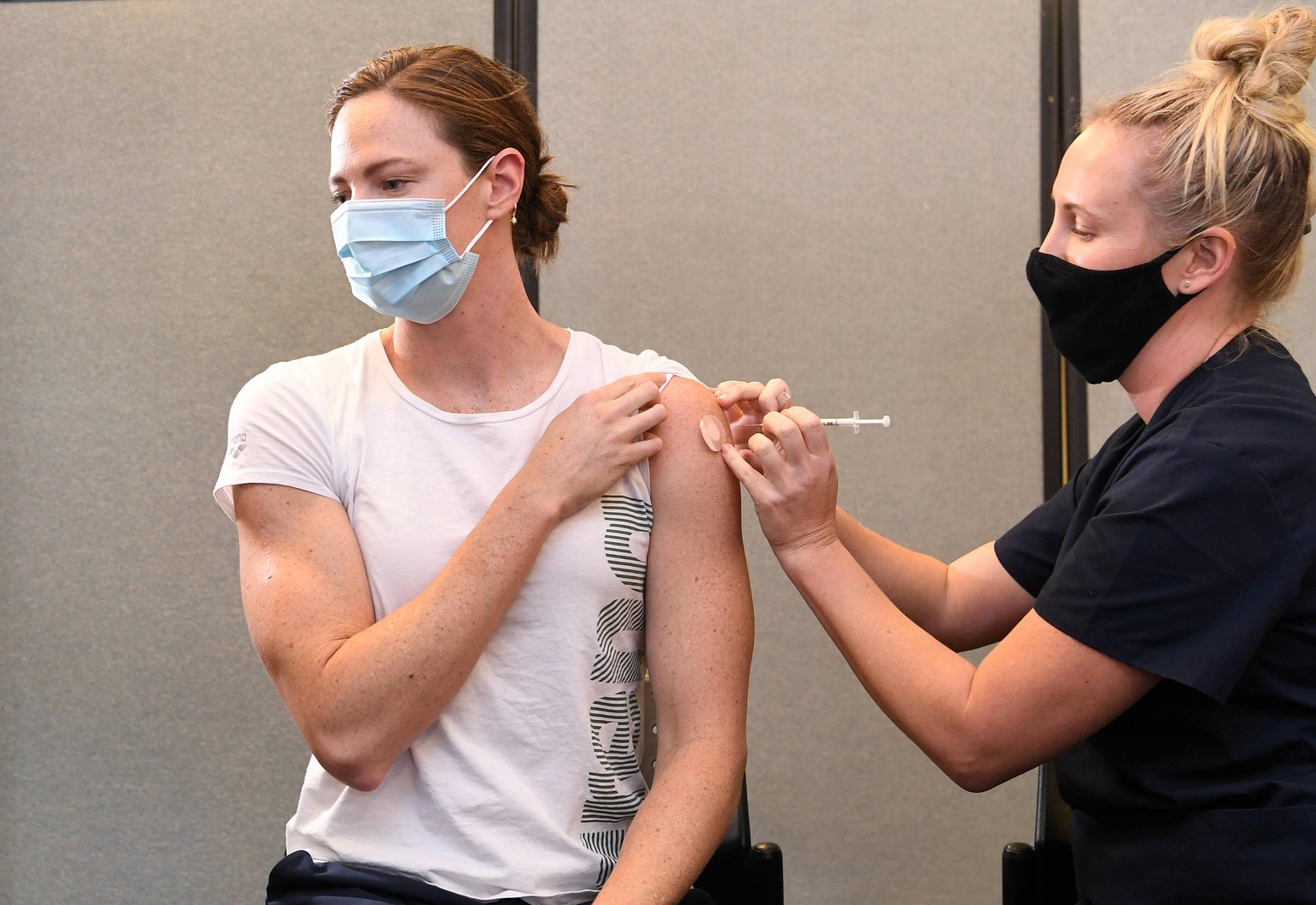 2020 OLYMPICS ATHLETE VACCINATION, Olympic swimmer Cate Campbell receives the Pfizer COVID-19 vaccine at the Queensland Academy of in Brisbane, Monday, May 10, 2021. Selected athletes and prospective  ...