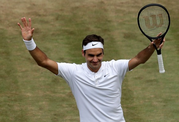 epa06088018 Roger Federer of Switzerland celebrates winning against Tomas Berdych of the Czech Republic during their semi final match for the Wimbledon Championships at the All England Lawn Tennis Clu ...