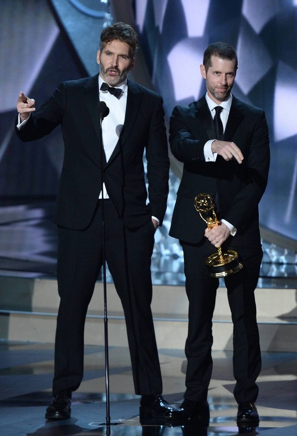 Writer/producers DB Weiss (L) and David Benioff (R) accept the award for Outstanding Writing for a Drama Series for Game of Thrones episode Battle of the Bastards on stage during the 68th annual Prim...