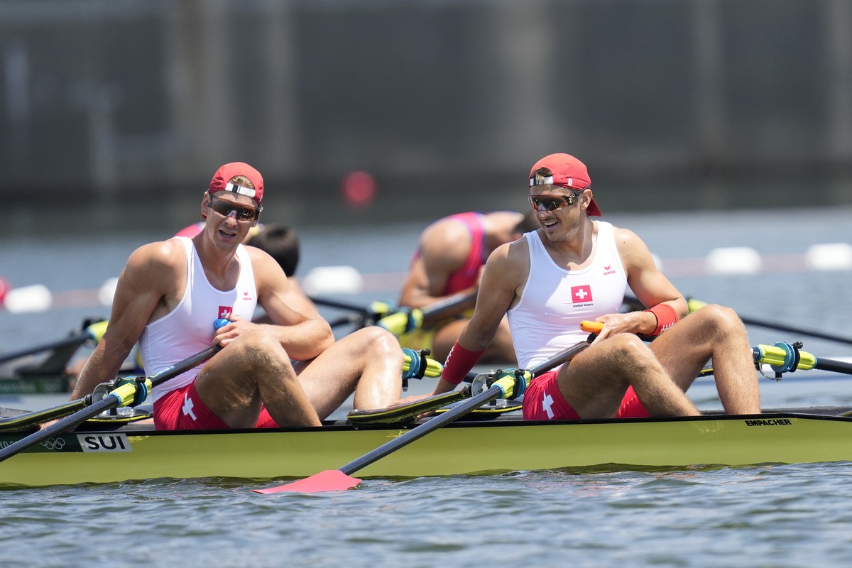 Barnabe Delarze and Roman Roeoesli of Switzerland react after competing in the men's double sculls semifinal at the 2020 Summer Olympics, Sunday, July 25, 2021, in Tokyo, Japan. (AP Photo/Lee Jin ...