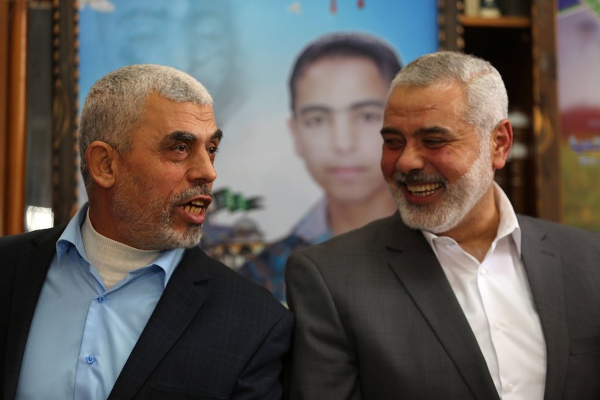 March 22, 2017 - Gaza, Palestine - Senior Hamas leader Ismail Haniya, and leader of Hamas in the Gaza Strip, Yahya Sinwar, visit the family of late Hamas leader Sheikh Ahmed Yassin, who was killed in  ...