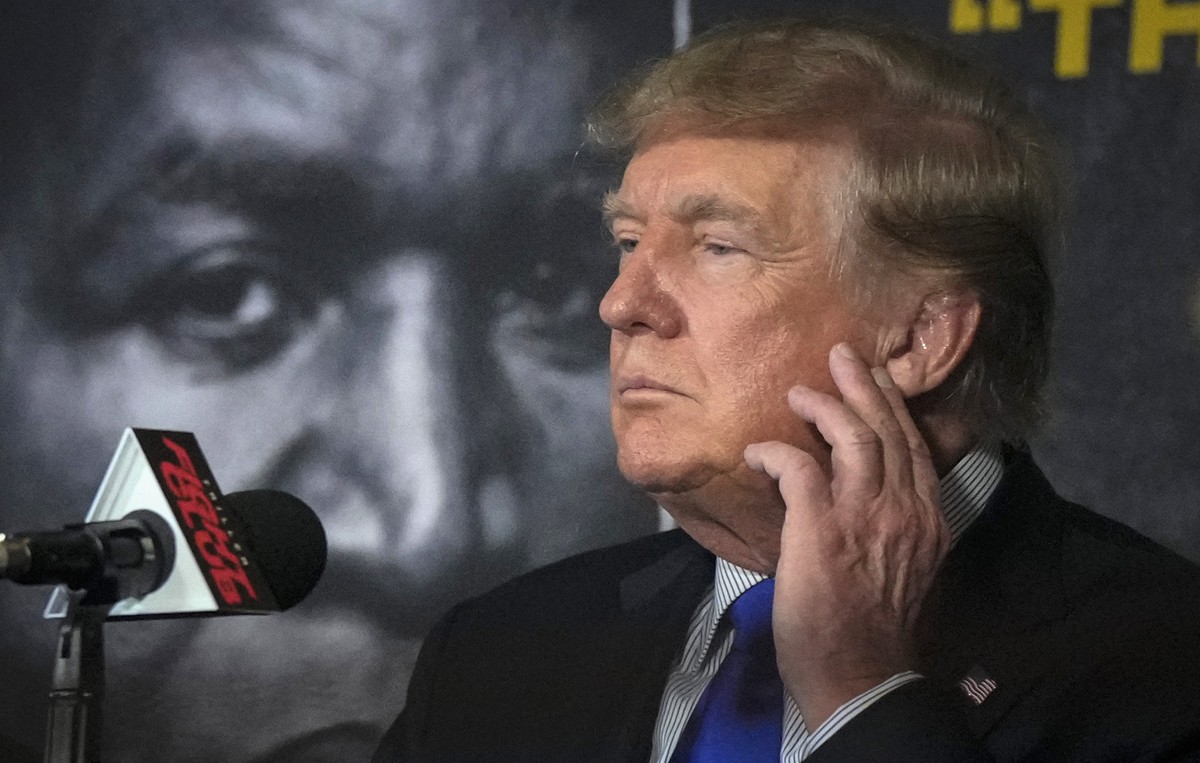 FILE - Former President Donald Trump prepares to provide commentary for a boxing event headlined by former heavyweight champ Evander Holyfield, Sept. 11, 2021, in Hollywood, Fla. New York's attor ...