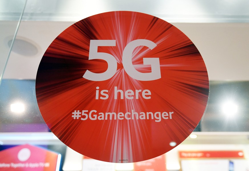epa08172232 A 5G sign is is on display in a phone store in London, Britain, 28 January 2020. The Government is set to make a statement on whether Britain is to allow Chinese company Huawei to run its  ...