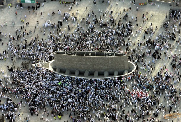 FILE- This Sunday, Dec. 31, 2006 file photo, shows an aerial view of one of three huge stone pillars as Muslim pilgrims are seen casting stones at it in the symbolic stoning of the devil for the secon ...