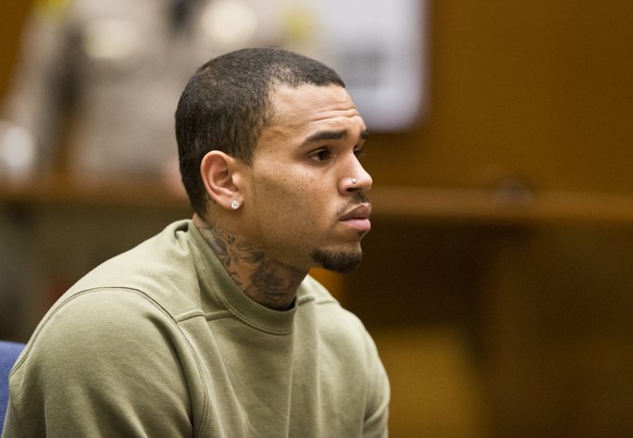 R&amp;B singer Chris Brown appears in Los Angeles Superior Court on Los Angeles Thursday, Jan. 15, 2015. A judge has revoked Chris Brown’s probation on Thursday after the R&amp;B singer traveled witho ...