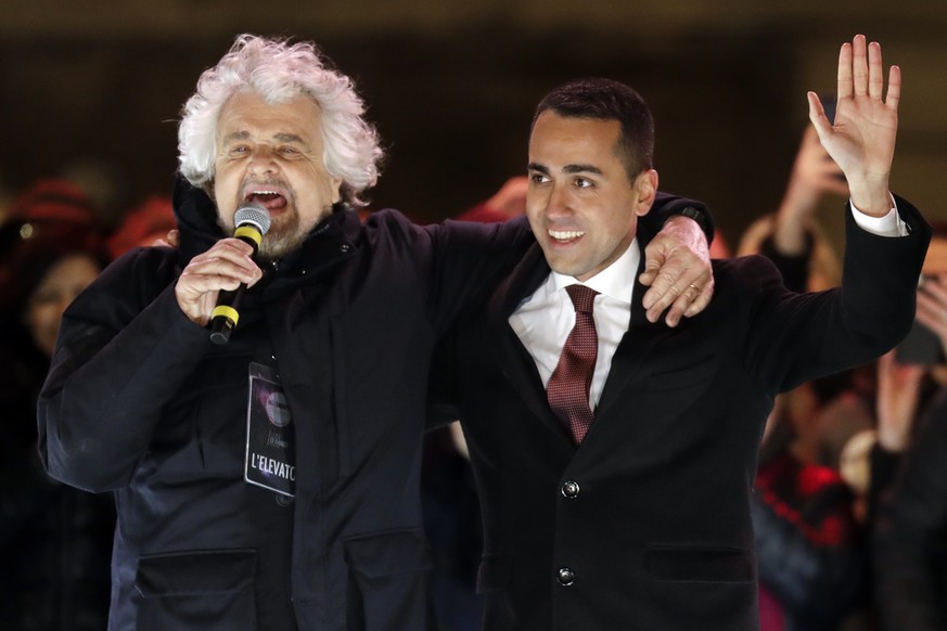 Five-Star Movement (M5S) candidate premier, Luigi Di Maio, right, and party founder Beppe Grillo attend their party&#039;s final rally in Rome, Friday, March 2, 2018. General elections in Italy will b ...