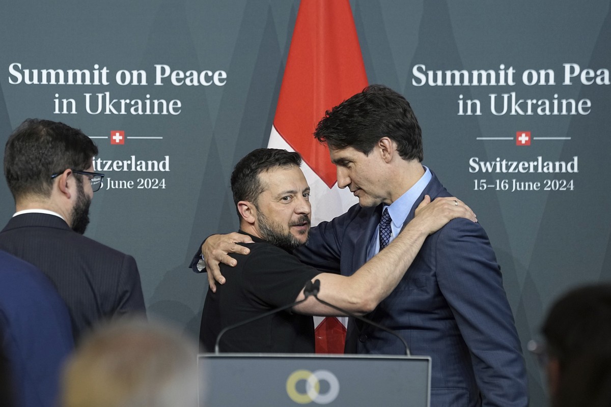 Ukraine's President Volodymyr Zelenskyy hugs with Canada Prime Minister Justin Trudeau during the closing press conference of the Ukraine peace summit in Obb�rgen, Switzerland, Sunday, June 16, 2 ...