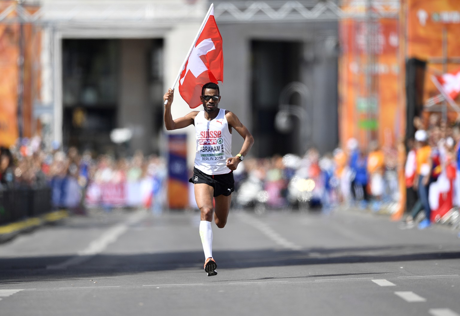 Switzerland&#039;s Tadesse Abraham celebrates when winning the silver medal in the men&#039;s marathon at the European Athletics Championships in downtown Berlin, Germany, Sunday, Aug. 12, 2018. (AP P ...