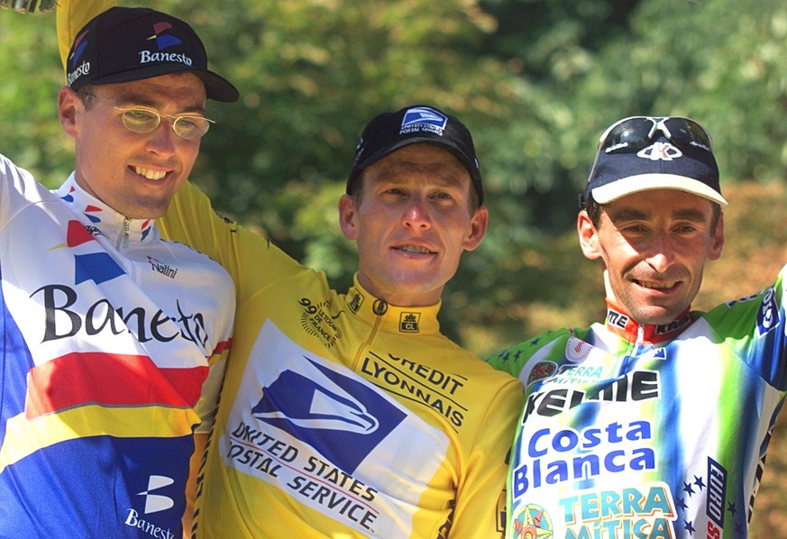 Tour de France winner Lance Armstrong of the U.S., center, poses with second-placed Alex Zuelle of Switzerland, left, and third-placed Fernando Escartin of Spain after the 20th and final stage of the ...