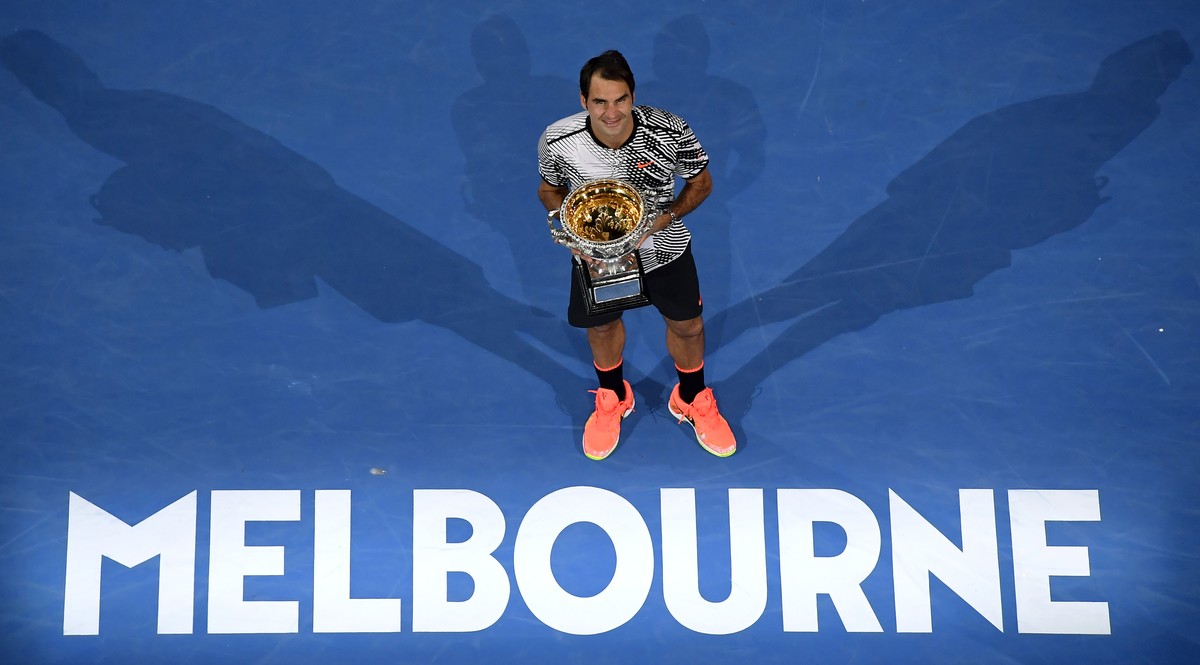 FILE - In this Jan. 29, 2017, file photo, Switzerland's Roger Federer poses with his trophy after defeating Spain's Rafael Nadal in the men's singles final at the Australian Open tennis ...