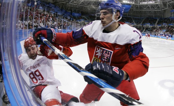 Dominik Kubalik (18), of the Czech Republic, checks Russian athlete Nikita Nesterov (89) during the second period of the semifinal round of the men&#039;s hockey game at the 2018 Winter Olympics in Ga ...