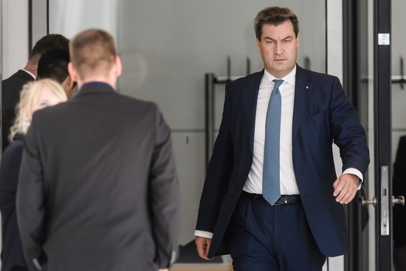 epa06806665 The state premier of the state of Bavaria Markus Soeder takes a walk during extraordinary seperated CDU and CSU parliamentary group meetings in Berlin, Germany, 14 June 2018. CDU and CSU d ...