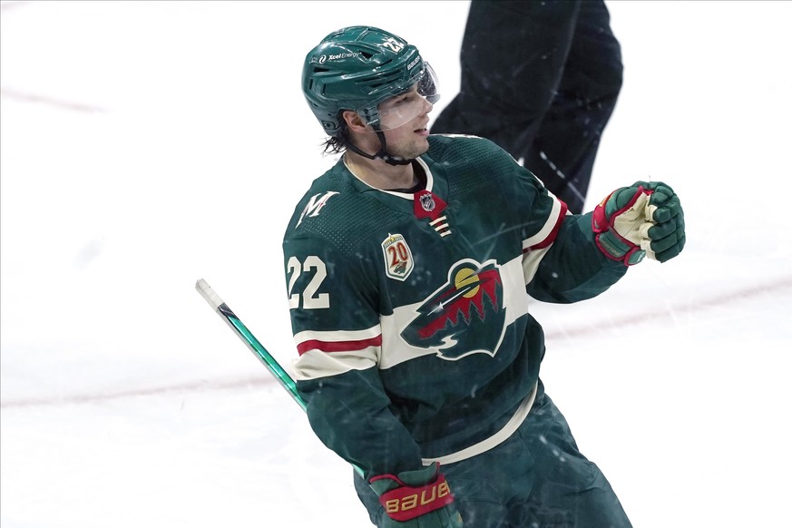 Minnesota Wild&#039;s Kevin Fiala (22) celebrates his empty-net goal against the San Jose Sharks in the third period of an NHL hockey game, Friday, Jan. 22, 2021, in St. Paul, Minn. (AP Photo/Jim Mone ...