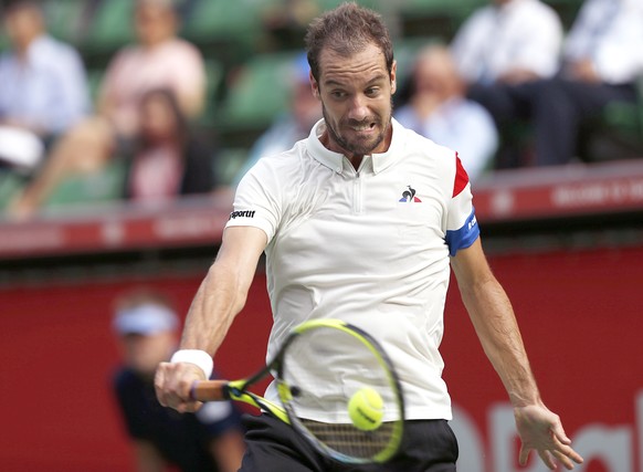 Richard Gasquet of France returns a shot against Sam Querrey of the United States during their singles match at the Japan Open men&#039;s tennis tournament in Tokyo, Tuesday, Oct. 3, 2017. (AP Photo/K ...