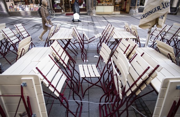 epa08315434 Empty tables and benches outside a restaurant at Marienplatz in Munich, Bavaria, Germany, 23 March 2020. The German government and local authorities are heightening measures to stem the sp ...