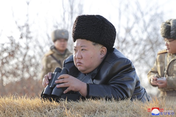 In this photo provided on Friday, Feb. 28, 2025, by the North Korean government, North Korean leader Kim Jong Un oversees the test firings of what it says are strategic cruise missiles off the country ...