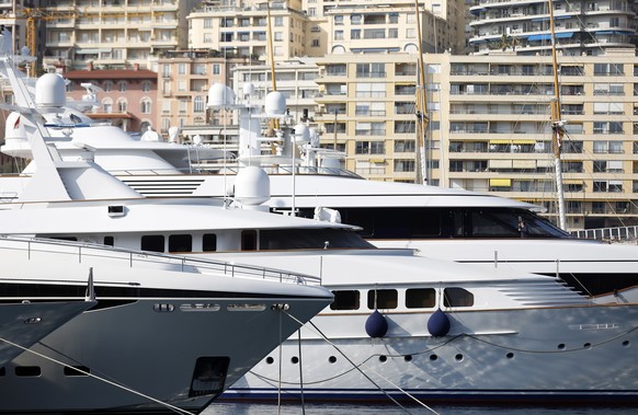 epa09814666 Yachts are moored up at Port Hercules in Monaco, 09 March 2022 (issued 10 March 2022). Monaco was quick to announce that it had joined the EU to sanction the list published of some 500 oli ...