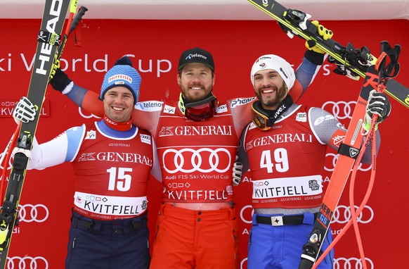 Norway&#039;s Kjetil Jansrud, center, winner of an alpine ski, men&#039;s World Cup super-G, poses on the podium wire second placed Switzerland&#039;s Beat Feuz, left, and third placed France&#039;s B ...