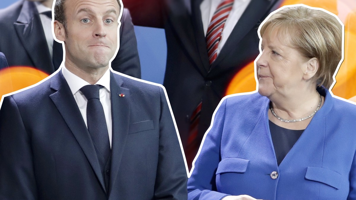 German Chancellor Angela Merkel, front right, speaks with French President Emmanuel Macron, front center, during a group photo at a conference on Libya at the chancellery in Berlin, Germany, Sunday, J ...
