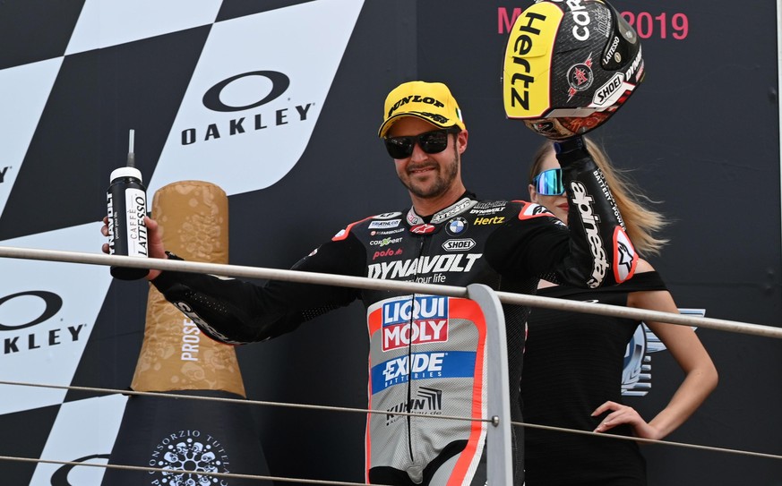 epa07619986 Swiss Moto2 rider Thomas Luethi of Dynavolt Impact GP celebrates on the podium after taking the third place in the Motorcycling Grand Prix of Italy at the Mugello circuit in Scarperia, cen ...