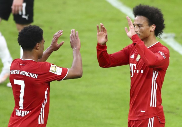 Bayern's Leroy Sane, right, celebrates with Bayern's Serge Gnabry after scoring his side's sixth goal during the German Bundesliga soccer match between Bayern Munich and Borussia Moench ...