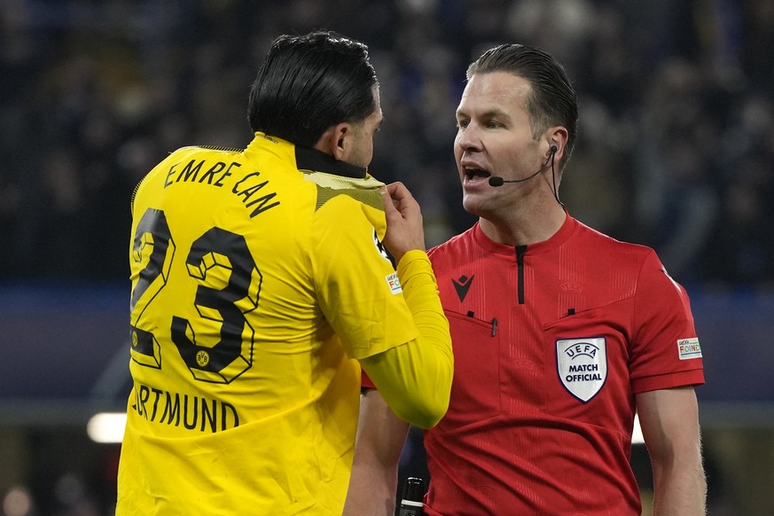Dortmund&#039;s Emre Can, left, talks with Referee Danny Makkelie from Netherlands after the Champions League round of 16 second leg soccer match between Chelsea FC and Borussia Dortmund at Stamford B ...