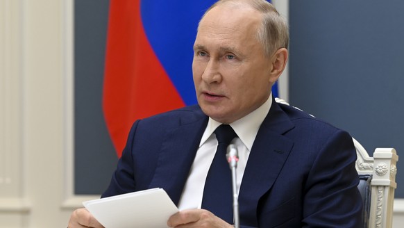 Russian President Vladimir Putin takes part in a video call with Belarusian President Alexander Lukashenko and Russian and Belarusian officials in Moscow, Russia, Thursday, July 1, 2021. (Alexei Nikol ...