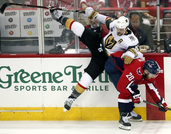 Washington Capitals forward Lars Eller (20), of Denmark, checks Vegas Golden Knights defenseman Luca Sbisa (47), of Italy, during the second period in Game 3 of the NHL hockey Stanley Cup Final, Satur ...
