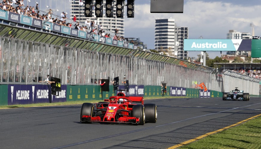 Ferrari driver Sebastian Vettel of Germany leads Mercedes driver Lewis Hamilton of Britain during the Australian Formula One Grand Prix in Melbourne, Australia, Sunday, March 25, 2018. (AP Photo/Asank ...