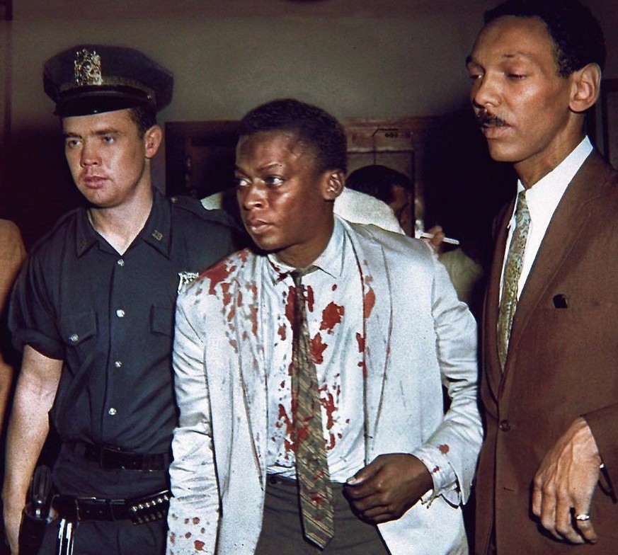 (Original Caption) New York, New York: Musician Arrested. West 54th Street Station House---18th Precinct. Miles Davis, 32, of 881 10th Avenue, a trumpeter now appearing in Birdland, 52nd Street and Br ...